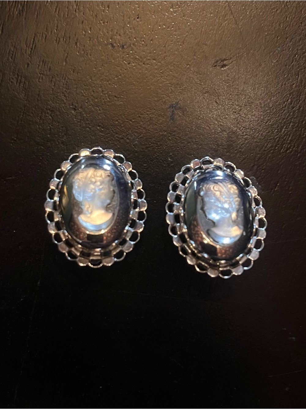Vintage silver tone cameo clip earrings with translucent cameo